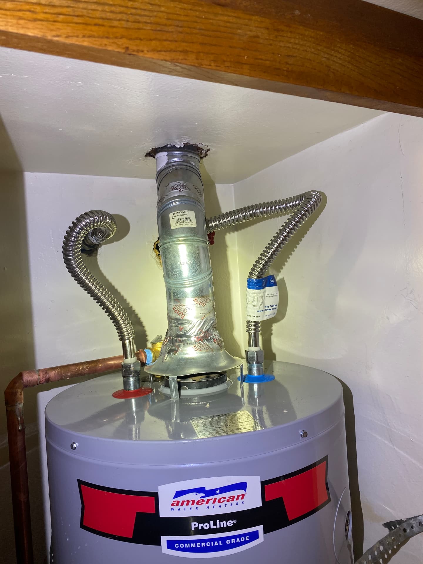 Water heater flex connectors and vent connector installed to code
